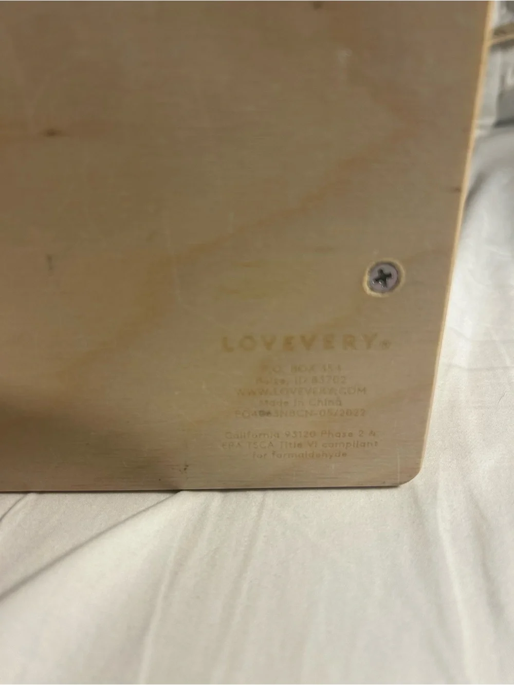 Lovevery Wooden Rotating Toy with Orange and Red Panels